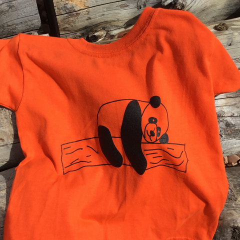 t shirt kids sleepy panda bear resting on log black print Gildan brand 50/50 cotton polyester blend lib washable minimal shrinkage bright orange easy to spot on hunt